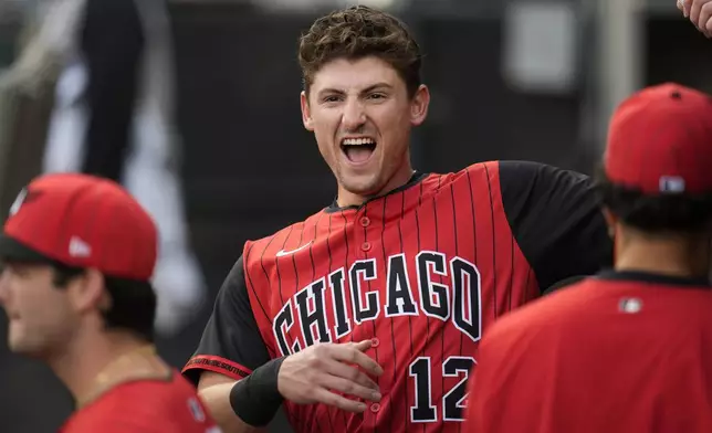 Chicago White Sox's Colson Montgomery (12) rallies with his team in the dugout before a baseball game against the Cleveland Guardians, Friday, Aug. 8, 2025, in Chicago. (AP Photo/Erin Hooley)