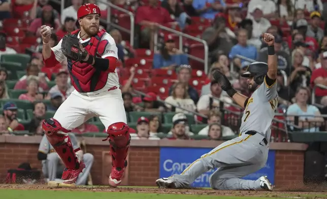 Pittsburgh Pirates' Isiah Kiner-Falefa (7) is forced out at home by St. Louis Cardinals catcher Pedro Pages during the sixth inning of a baseball game Wednesday, Aug. 27, 2025, in St. Louis. (AP Photo/Jeff Roberson)