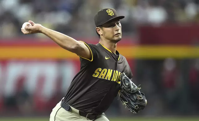 San Diego Padres starting pitcher Yu Darvish, of Japan, throws against the Arizona Diamondbacks during the first inning of a baseball game Tuesday, Aug. 5, 2025, in Phoenix. (AP Photo/Ross D. Franklin)