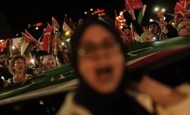 Protesters chant slogans during a pro-Palestinian demonstration outside the Byzantine-era Hagia Sophia Mosque in Istanbul, Saturday, Aug. 9, 2025. (AP Photo/Khalil Hamra)