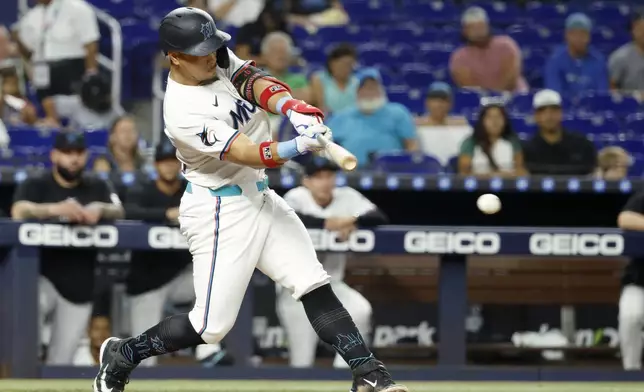 Miami Marlins' Heriberto Hernandez hits an RBI single during the third inning of a baseball game against the St. Louis Cardinals, Wednesday, Aug. 20, 2025, in Miami. (AP Photo/Rhona Wise)