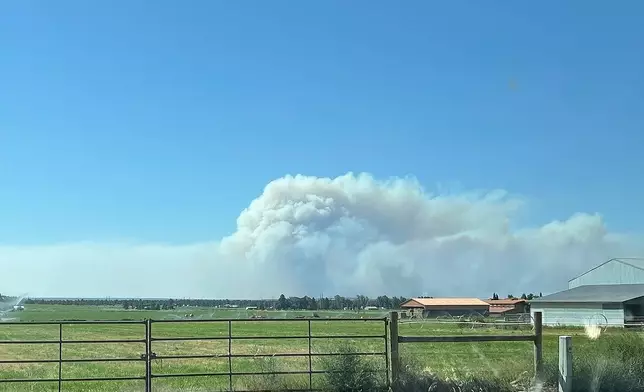 In this photo provided by the Deschutes County Sheriff's Office, smoke plumes from a wildfire in Jefferson County, Ore., Friday, Aug. 22, 2025. (Deschutes County Sheriff's Office via AP)