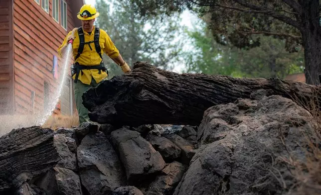 In this photo provided by Deschutes County Sheriff's Office, crews battle the Flat Fire in central Oregon, Sunday, Aug. 24, 2025. (Deschutes County Sheriff's Office via AP)