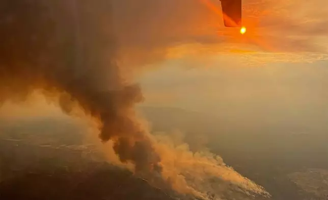 This aerial photo provided by Deschutes County Sheriff's Office shows smoke from the Flat Fire burning in central Oregon, Monday, Aug. 25, 2025. (Deschutes County Sheriff's Office via AP)