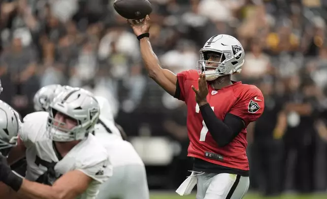 Las Vegas Raiders quarterback Geno Smith (7) throws at the team's NFL football training camp Saturday, Aug. 2, 2025, in Las Vegas. (AP Photo/John Locher)
