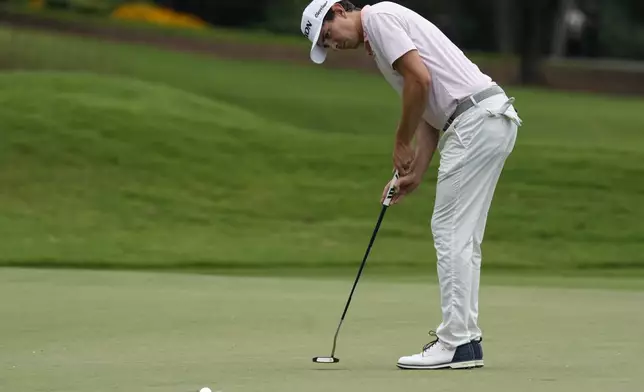 Nico Echavarria, of Colombia, sinks a birdie putt on the eighth hole during the final round of the Wyndham Championship golf tournament in Greensboro, N.C., Sunday, Aug. 3, 2025. (AP Photo/Chuck Burton)