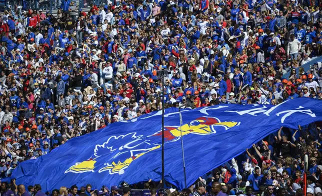 FILE - Kansas fans fill David Booth Kansas Memorial Stadium for the third straight time for an NCAA college football game against TCU, Oct. 8, 2022, in Lawrence, Kan. (AP Photo/Reed Hoffmann, file)