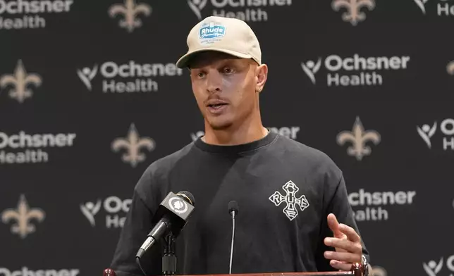 New Orleans Saints quarterback Spencer Rattler responds to questions during a news conference after a loss to the Denver Broncos in an NFL preseason football game Saturday, Aug. 23, 2025, in New Orleans. (AP Photo/Gerlad Herbert)