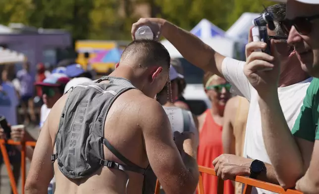 Hood to Coast relay race runners and supporters at Exchange Point 12 near Oregon Museum of Science and Industry in Southeast Portland, Friday, Aug. 22, 2025. (Teresa Mahoney/The Oregonian via AP)