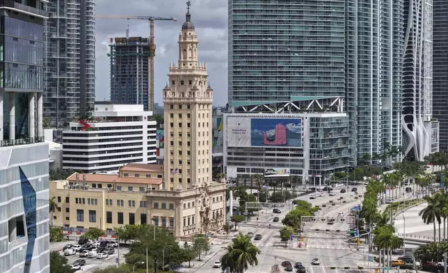 The Freedom Tower is seen in downtown Miami on Friday, Aug. 8, 2025. (AP Photo/Daniel Kozin)