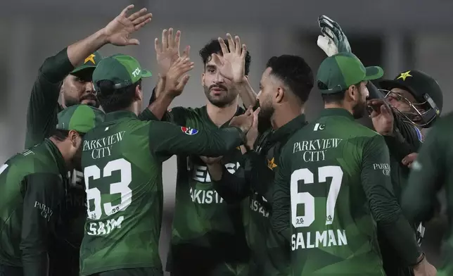 Pakistan's Saim Ayub, third left, celebrates with teammates after the dismissal of West Indies' Gudakesh Motie during the first Twenty20 cricket match between West Indies and Pakistan, in Lauderhill, Fla., Thursday, July 31, 2025. (AP Photo/Lynne Sladky)