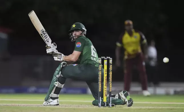 Pakistan's Salman Ali Agha plays a shot during the first Twenty20 cricket match between West Indies and Pakistan, in Lauderhill, Fla., Thursday, July 31, 2025. (AP Photo/Lynne Sladky)