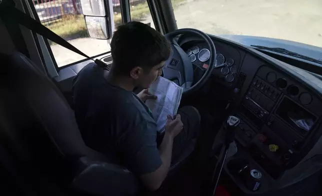 FILE - Student driver Edgar Lopez, 23, prepares for a practice driving session at California Truck Driving Academy in Inglewood, Calif., Monday, Nov. 15, 2021. (AP Photo/Jae C. Hong), File)