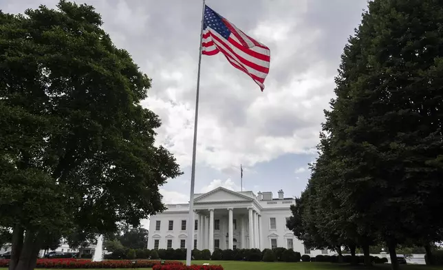 An American flag flies in front of the White House, Wednesday, July 23, 2025, in Washington. (AP Photo/Julia Demaree Nikhinson)