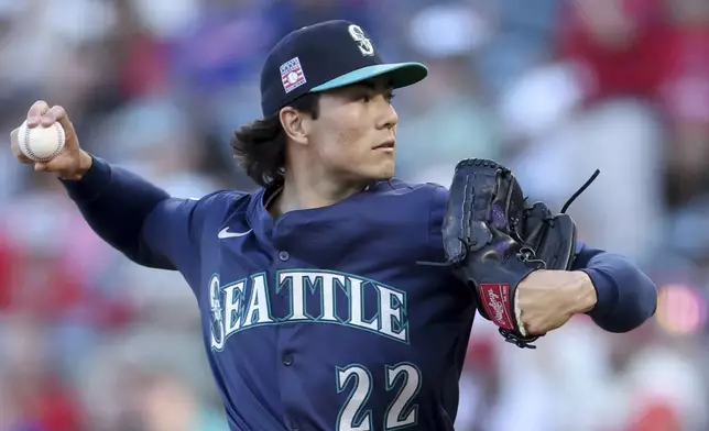 Seattle Mariners starting pitcher Bryan Woo delivers during the first inning of a baseball game against the Los Angeles Angels Friday, July 25, 2025, in Anaheim, Calif. (AP Photo/Eric Thayer)