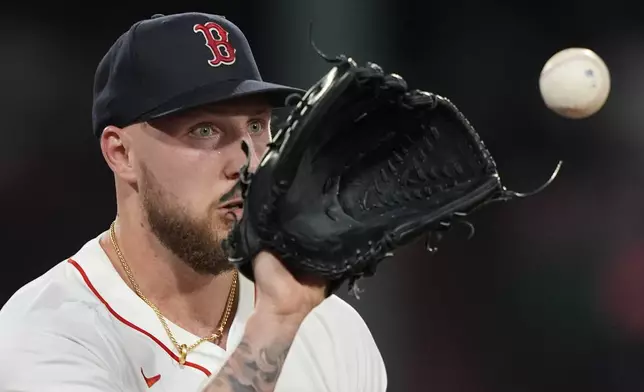 Boston Red Sox starting pitcher Garrett Crochet covers first base on a throw by first baseman Abraham Toro to make the out on Kansas City Royals Vinnie Pasquantino in the sixth inning, Tuesday, Aug. 5, 2025, in Boston. (AP Photo/Robert F. Bukaty)