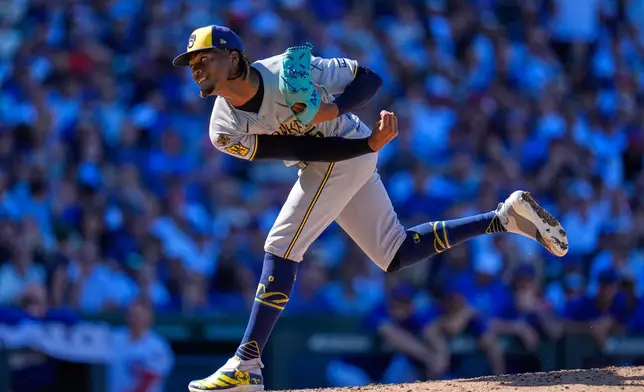 Milwaukee Brewers pitcher Abner Uribe throws against the Chicago Cubs during the eighth inning of a baseball game Thursday, Aug. 21, 2025, in Chicago. (AP Photo/Erin Hooley)
