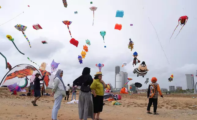 Kites of different shapes and sizes adorn the skies during the Colombo International Kite Festival, in Colombo, Sri Lanka, Saturday, Aug. 23, 2025. (AP Photo/Eranga Jayawardena)