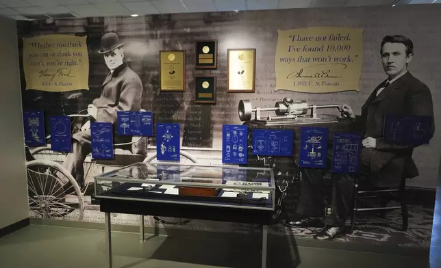 Pictures of Henry Ford, left, and Thomas Edison, right, are displayed in a museum, Saturday, Aug. 9, 2025, at the Edison and Ford Winter Estates, purchased in 1885 by Edison, and later Ford purchased the adjoining property, in Fort Myers, Fla. (AP Photo/Lynne Sladky)