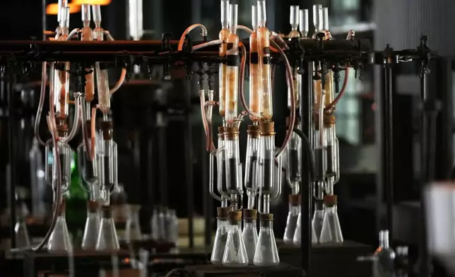 Glass beakers are displayed at the Edison Botanic Research Laboratory at the Edison and Ford Winter Estates, Saturday, Aug. 9, 2025, in Fort Myers, Fla. (AP Photo/Lynne Sladky)