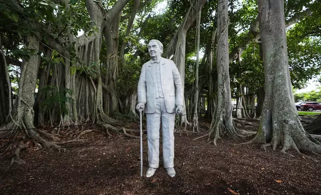 A sculpture of Thomas Edison stands at the entrance to the Edison and Ford Winter Estates, Saturday, Aug. 9, 2025, in Fort Myers, Fla. (AP Photo/Lynne Sladky)