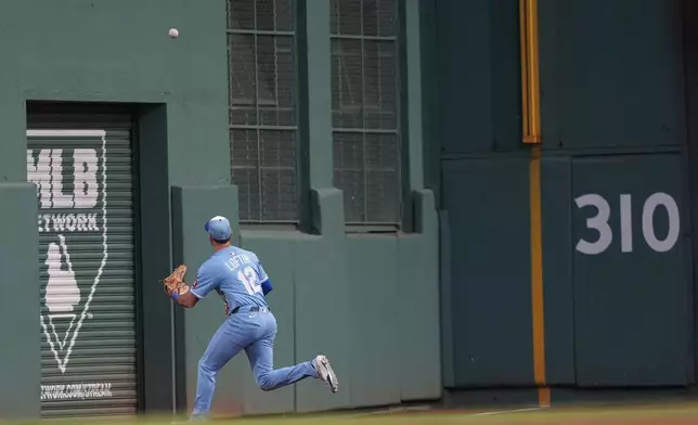 Kansas City Royals outfielder Nick Loftin fields a hit off the Green Monster in left field by Boston Red Sox Jarren Duran in the third inning of a baseball game, Tuesday, Aug. 5, 2025, in Boston. (AP Photo/Robert F. Bukaty)