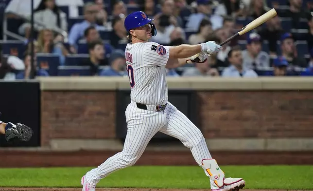 New York Mets' Pete Alonso follows through on a two-run home run during the third inning of a baseball game against the Atlanta Braves Tuesday, Aug. 12, 2025, in New York. (AP Photo/Frank Franklin II)