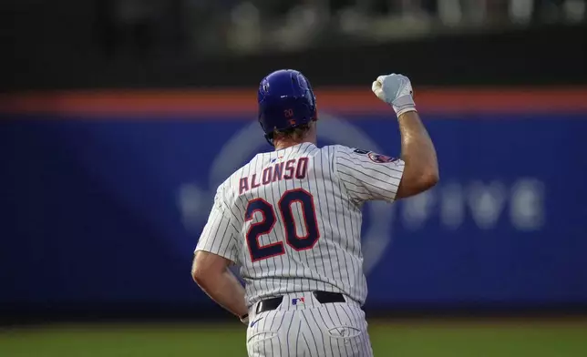 New York Mets' Pete Alonso (20) gestures as he runs the bases after hitting a two-run home run during the third inning of a baseball game against the Atlanta Braves Tuesday, Aug. 12, 2025, in New York. (AP Photo/Frank Franklin II)