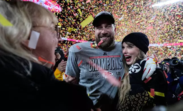 FILE - Donna Kelce stands with her son Kansas City Chiefs tight end Travis Kelce and Taylor Swift after the AFC Championship NFL football game against the Buffalo Bills, Jan. 26, 2025, in Kansas City, Mo. (AP Photo/Ashley Landis, File)