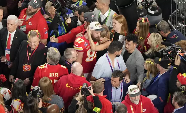 FILE - Kansas City Chiefs tight end Travis Kelce (87) hugs his girlfriend Taylor Swift after the team's victory over the San Francisco 49ers during the NFL Super Bowl 58 football game, Feb. 11, 2024, in Las Vegas. (AP Photo/David J. Phillip, File)