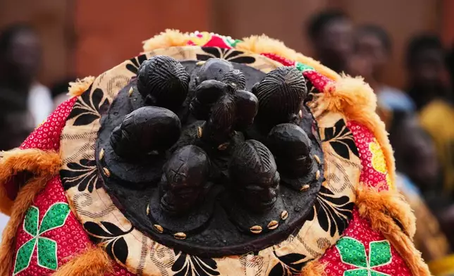 A man dressed in a costume performs during the mask festival in Porto Novo, Benin , Saturday, Aug. 2, 2025. (AP Photo/Sunday Alamba)