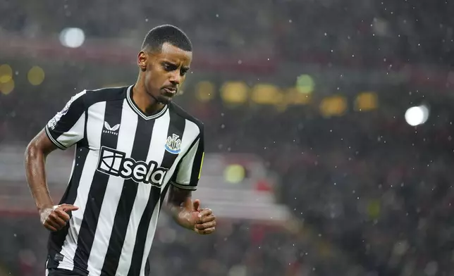 FILE - Newcastle's Alexander Isak celebrates after scoring his side's opening goal during the English Premier League soccer match between Liverpool and Newcastle, at Anfield stadium in Liverpool, England, Monday, Jan. 1, 2024. (AP Photo/Jon Super, File)