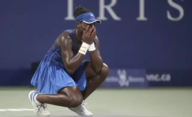 Victoria Mboko, of Canada, celebrates after her win over Naomi Osaka, of Japan, in finals action at the National Bank Open women's tennis tournament in Montreal, Thursday, Aug. 7, 2025. (Christinne Muschi/The Canadian Press via AP)