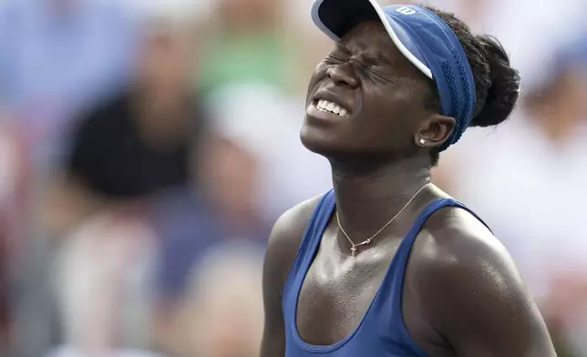 Victoria Mboko, of Canada, reacts during her match against Naomi Osaka, of Japan, during finals action at the National Bank Open women's tennis tournament in Montreal, Thursday, Aug. 7, 2025. (Christinne Muschi/The Canadian Press via AP)