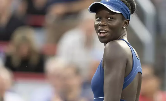 Victoria Mboko, of Canada, reacts during her match against Naomi Osaka, of Japan, during finals action at the National Bank Open women's tennis tournament in Montreal, Thursday, Aug. 7, 2025. (Christinne Muschi/The Canadian Press via AP)