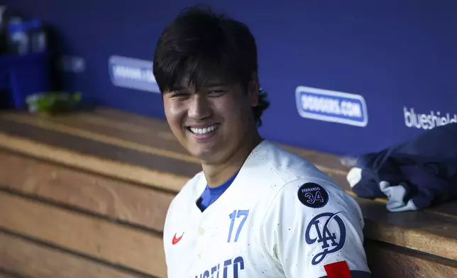 Los Angeles Dodgers' Shohei Ohtani (17) reacts in the dugout during the second inning of a baseball game against the Toronto Blue Jays, Saturday, Aug. 9, 2025, in Los Angeles. (AP Photo/Jessie Alcheh)
