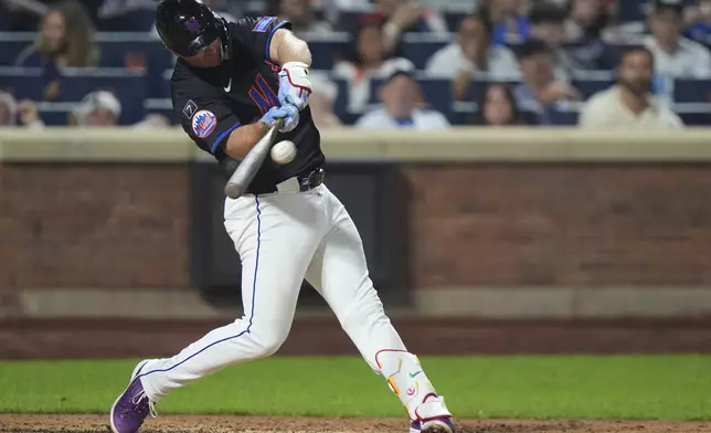 New York Mets' Pete Alonso hits a home run during the seventh inning of a baseball game against the San Francisco Giants Friday, Aug. 1, 2025, in New York. (AP Photo/Frank Franklin II)