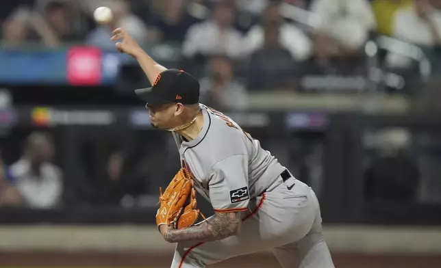 San Francisco Giants' José Buttó pitches during the eighth inning of a baseball game against the New York Mets Friday, Aug. 1, 2025, in New York. (AP Photo/Frank Franklin II)