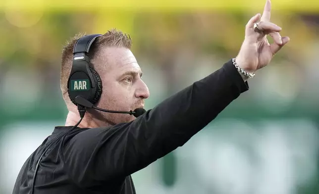 South Florida head coach Alex Golish calls a play against Boise State during the second half of an NCAA college football game Thursday, Aug. 28, 2025, in Tampa, Fla. (AP Photo/Chris O'Meara)