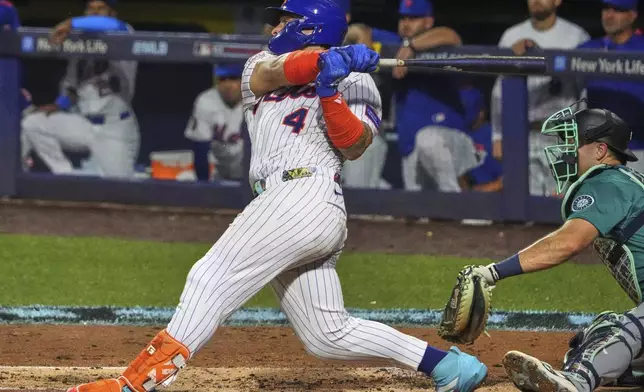 New York Mets' Francisco Alvarez follows through on a double off Seattle Mariners pitcher George Kirby, driving in a run, during the second inning of the Little League Classic baseball game at Bowman Field in Williamsport, Pa., Sunday, Aug. 17, 2025. (AP Photo/Gene J. Puskar)