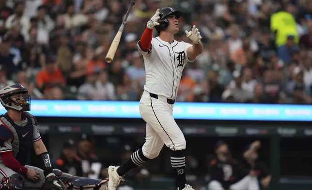 Detroit Tigers' Kerry Carpenter tosses his bat after hitting a go-ahead two-run home run during the sixth inning of a baseball game against the Minnesota Twins, Monday, Aug. 4, 2025, in Detroit. (AP Photo/Ryan Sun)