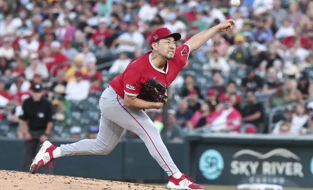 Los Angeles Angels pitcher Yusei Kikuchi throws to the Athletics during the second inning of a baseball game Friday, Aug. 15, 2025, in West Sacramento, Calif. (AP Photo/Sara Nevis)
