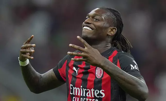 AC Milan's Rafael Leao celebrates after scoring the opening goal during the round of 64 of the Italian Cup soccer match between Milan and Bari, at San Siro Stadium in Milan, Italy, Sunday, Aug. 17, 2025. (Spada/LaPresse via AP)