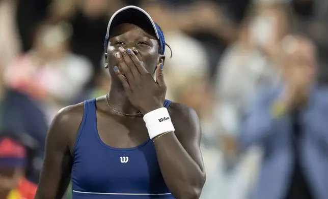 Victoria Mboko, of Canada, celebrates her win over Jessica Bouzas Maneiro, of Spain, during quarterfinal action at the National Bank Open women's tennis tournament in Montreal, Monday, Aug. 4, 2025. (Christinne Muschi/The Canadian Press via AP)