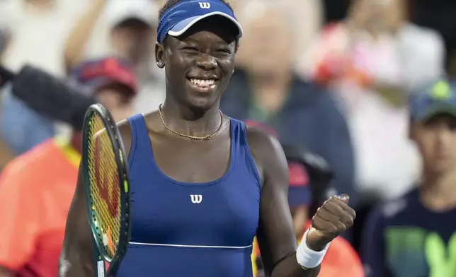 Victoria Mboko, of Canada, reacts after her win over Jessica Bouzas Maneiro, of Spain, during quarterfinal action at the National Bank Open women's tennis tournament in Montreal, Monday, Aug. 4, 2025. (Christinne Muschi/The Canadian Press via AP)