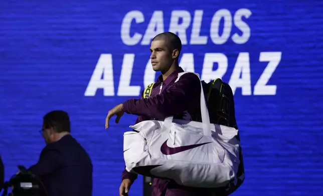 Carlos Alcaraz, of Spain, is introduced before a match against Reilly Opelka, of the United States, during the first round of the U.S. Open tennis championships, Monday, Aug. 25, 2025, in New York. (AP Photo/Adam Hunger)