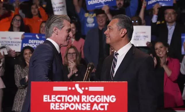 California Gov. Gavin Newsom, left, greets Sen. Alex Padilla, D-Calif., during a news conference Thursday, Aug. 14, 2025, in Los Angeles. (AP Photo/Marcio Jose Sanchez)