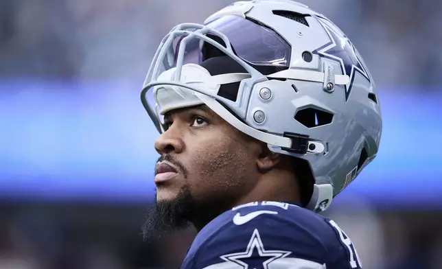 FILE - Dallas Cowboys linebacker Micah Parsons (11) walks on the sideline during an NFL football game against the Carolina Panthers, Sunday, Dec. 15, 2024, in Charlotte, N.C. (AP Photo/Brian Westerholt, File)