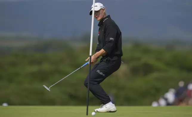 Charley Hull of England reacts after missing a putt on the 9th green during the final round of the Women's British Open golf championship, at Royal Porthcawl Golf Club in Porthcawl, Wales, Sunday, Aug. 3, 2025. (AP Photo/Kin Cheung)