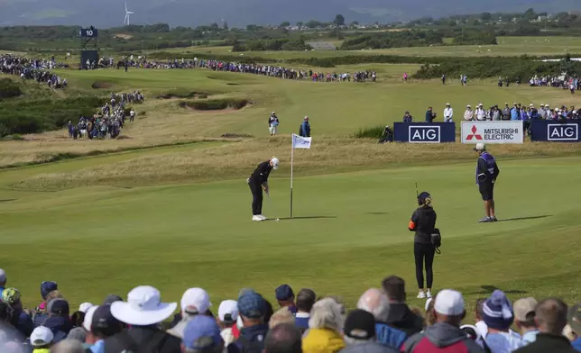Charley Hull of England putts on the 9th green during the final round of the Women's British Open golf championship, at Royal Porthcawl Golf Club in Porthcawl, Wales, Sunday, Aug. 3, 2025. (AP Photo/Kin Cheung)